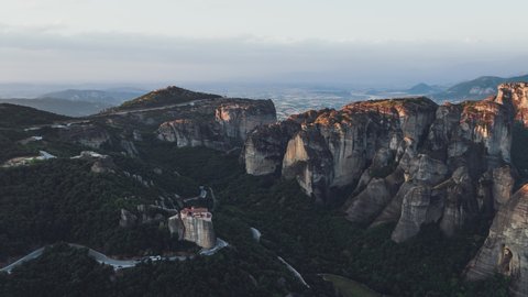 Aerial View of Meteora, Complex of Eastern Orthodox Monasteries, Greece, flying over Monastery of Rousanou and in background Holy Trinity Monastery and Monastery of St. Stephen