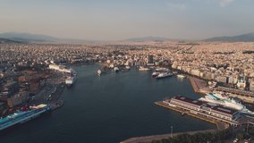 Establishing Aerial View Shot of Athens, Port of Piraeus, ships awaiting, late afternoon, Greece