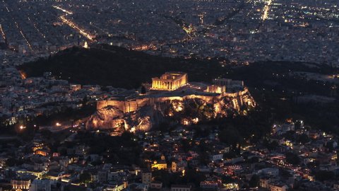 Establishing Aerial View Shot of Athens, Parthenon, Acropolis, Greece at night evening from up high