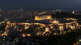 Establishing Aerial View Shot of Athens, Parthenon, iconic Acropolis, Greece at night evening