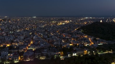 Reveling Establishing Aerial View Shot of Athens, Parthenon, Acropolis, Greece at night evening