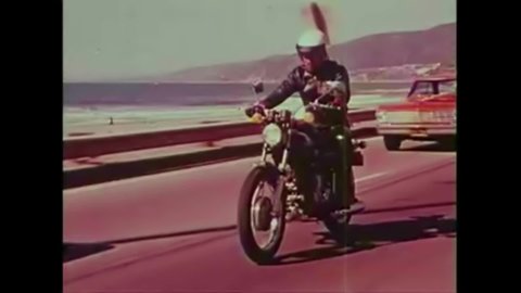 CIRCA 1970s - Motorcycle police officers demonstrate complex motorcycle riding formations while Peter Fonda narrates in this motorcycle safety film.