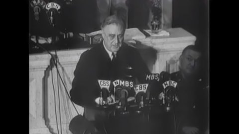 CIRCA 1940s - President Roosevelt gives a speech in front of the congress and asks the American people to produce war weaponry in 1942.