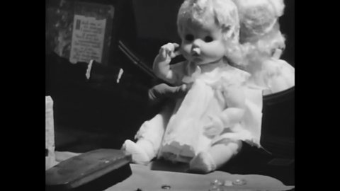 CIRCA 1969 - In this exploitation movie, a juvenile delinquent uses a knife to gouge out a doll's eyes.