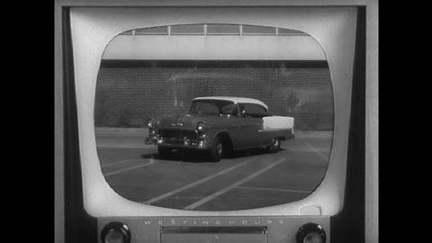 CIRCA 1950s - A man watches his wife drive on television and then arrive at their house in 1955.