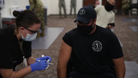 CIRCA 2020 Soldiers prepare the first COVID-19 vaccines to arrive and be administered at Joint Base San Antonio-Lackland, TX.