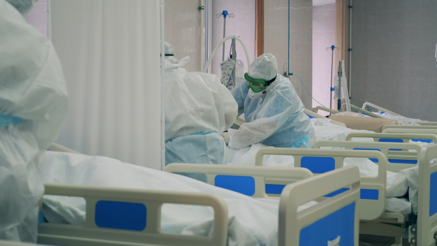 Nurses treating patients at coronavirus intensive care units Royalty-Free Stock Footage #1064401159