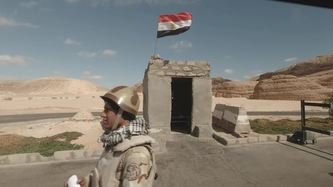 Egypt, Sharm El Sheikh - 02-10-2020: Blockpost in Sharm military with weapons in Sinai Mountains and Egyptian flag