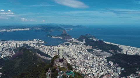 Christ Reedemer, Rio de Janeiro, Brazil. Panorama view of Rio de Janeiro scenery. Christ Redeemer at Sugarloaf Mountain. Rio de Janeiro, Brazil. Coastal exotic city landscape. Rio de Janeiro skyline.
