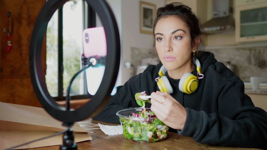 Young woman eating a salad