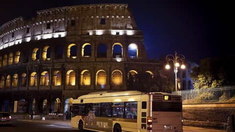 Illuminated Timelapse of the Roman Colosseum at night with a full moon Rome, Italy