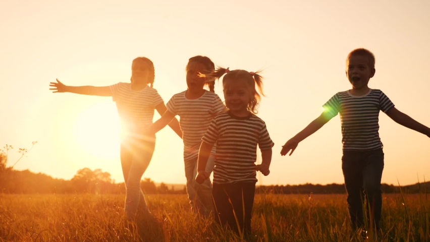 happy family children kid together run in the park at sunset silhouette. people in fun the park concept. happy family joyful run. happy family and little baby child summer kid dream concept Royalty-Free Stock Footage #1064429608