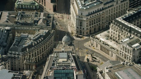 Aerial view of London city and Bank of England temporarily closed streets deserted enforced Coronavirus lockdown due to an infectious Global pandemic UK