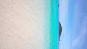 Vertical footage. Phuket beach sea sand and sky. Landscape view of Turquoise beach sea in summer day. Beach space area. At Karon Beach, Phuket, Thailand. On 15 June 2020. 4K UHD. Video Clip