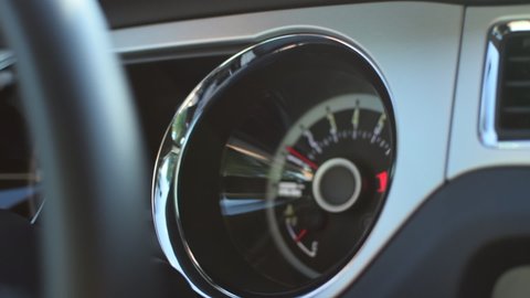 Close up of Speedometer in Sports Car Muscle Car Driving, Sunshine in Slow Motion