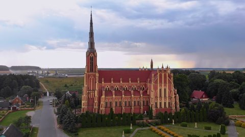 Aerial view over The Church of the Holy Trinity is a Catholic church in the agro-town Gervyaty, Grodno region, Belarus. Built in 1899-1903 in the neo-gothic style.
