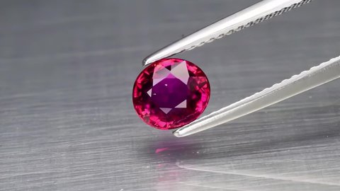 natural purple tourmaline on the grey background