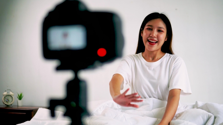 Asian woman blogger present her beauty supplement. Communicate sales to customers via live video. Online selling business via social media. 4K | Shutterstock HD Video #1064475217