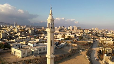 Mosque Tower Minaret in Palestine town, Aerial view
al-eizariya Town mosque minaret with speakers, Israel-palestine

