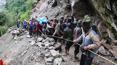 Rudraprayag, Uttarakhand, India, January 15 2020. Life at risk during flood relief in kedarnath . Government agencies transporting heavy machinery to find human bodies in flood debris. Disaster 2013.