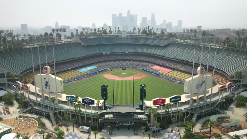 LOS ANGELES, CA, USA - NOV 15, 2020: Drone aerial shot, Slow motion 4k. Baseball stadium in downtown Los Angeles. View of LA skyline skyscrapers buildings. Urban modern city in America. 