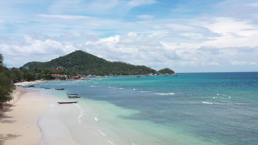 Aerial top view form flying drone of beautiful turquoise blue ocean tropical seascape island for summer vaction on paradise beach. Beautiful Koh Tao island, Surat Thani, Thailand. Royalty-Free Stock Footage #1064499247