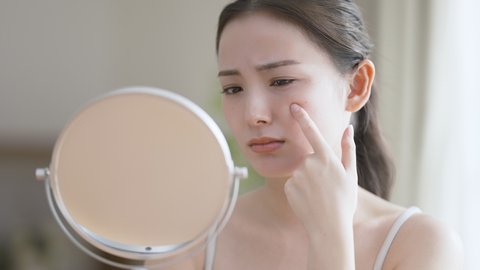 Young woman doing skin care