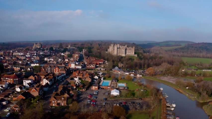 The historic town of Arundel aerial footage with the River Arun passing Arundel Cstle and the Cathedral in the background.