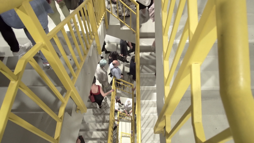 Sofia, Bulgaria - 23 May, 2019: People escape to fire exit stairs during terrorist attack danger in arena hall