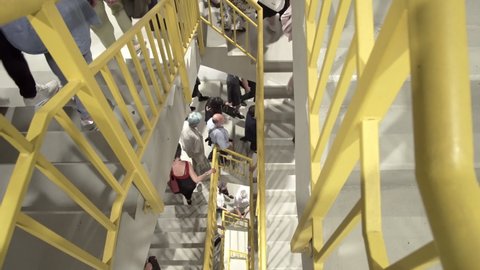 Sofia, Bulgaria - 23 May, 2019: People escape to fire exit stairs during terrorist attack danger in arena hall