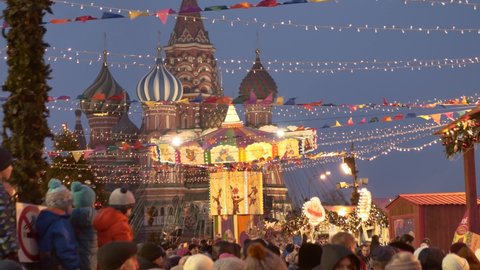 Moscow, Russia, January 3, 2020: People celebrate the New Year. They have fun, rejoice and dance. Children ride a carousel on Red Square. Holiday atmosphere