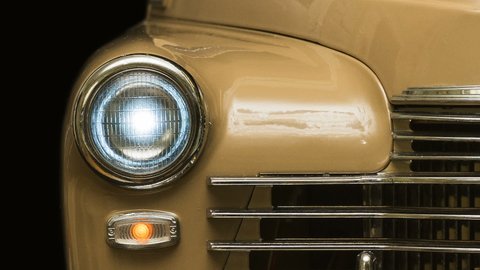 retro car with headlights close-up, panorama