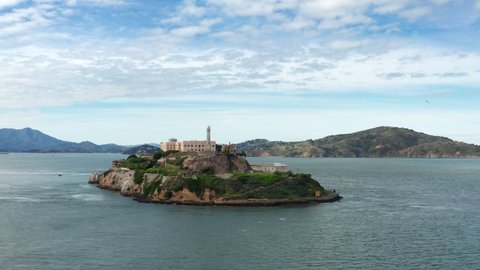 San Francisco, USA. Aerial view of former prison Alcatraz. Panorama of famous island with lighthouse built. High quality 4k footage