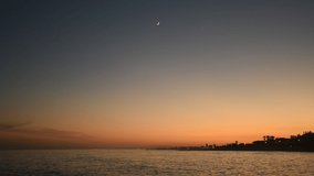 High quality video. Image of the sea with the moon. Image of small waves of the sea.