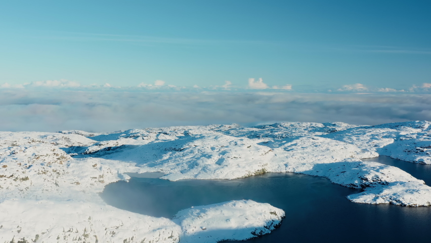 A mountain lake in the middle of snow-capped mountains. Alaska