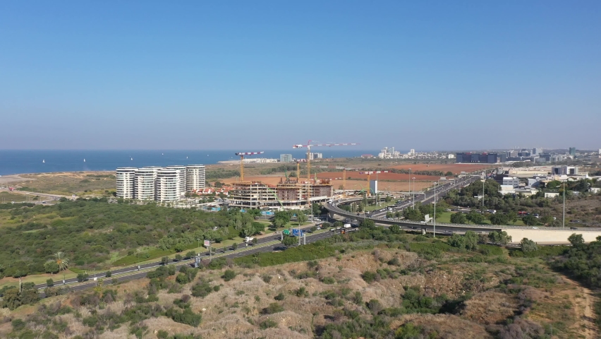 Aerial view of Tel Aviv Glilot highway interchange with traffic in all directions.