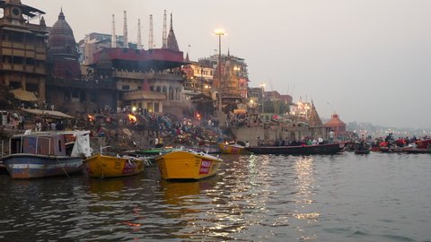 Varanasi, India - February 14, 2019: Hindu ritual cremation ceremony at Manikarnika Ghat on the banks of the sacred Ganges River in Varanasi, Uttar Pradesh, India.  