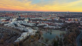 Munich aerial skyline view at sunrise fly over westpark, munich downtown olympia tv tower city centre drone video munchen germany.