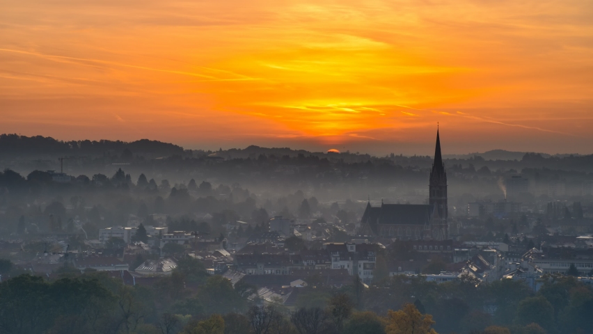 Amazing sunrise over the city of Graz with Church of the Sacred Heart of Jesus 4K timelapse in Graz, Styria region, Austria.