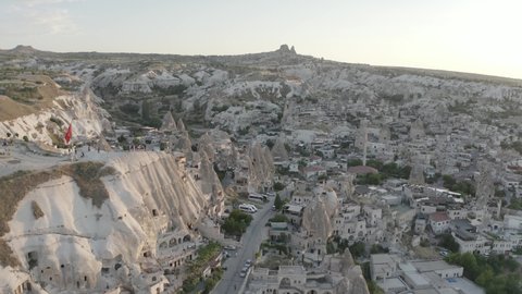 Sunset Aerial View of Göreme and Cave hotel near Sunset Point, Cappadocia, Turkey - Professional Aerial Footage 4k