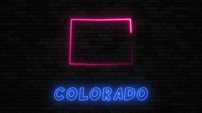 State of Colorado map silhouette with neon line on a dark brick wall background