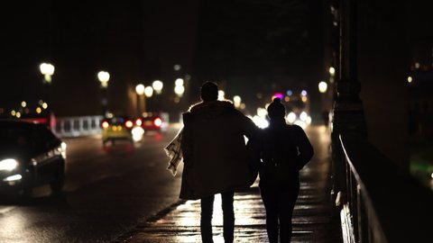 Newcastle upon Tyne UK: 11th Dec 2020: Pedestrians on the Tyne Bridge in Newcastle at night 