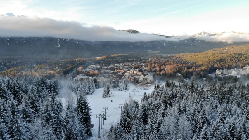 Aerial hyperlapse of Whistler Village and ski runs at sunset. 4K 24FPS.