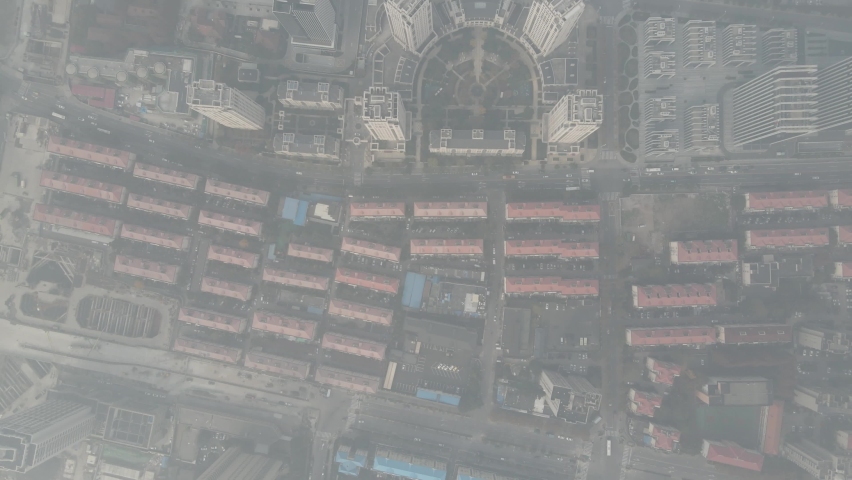 City in heavy haze and air pollution. Building and roads in fog in day time. Environmental conservation and air pollution issues concept b-roll footage. Highly polluted residential area Shanghai China