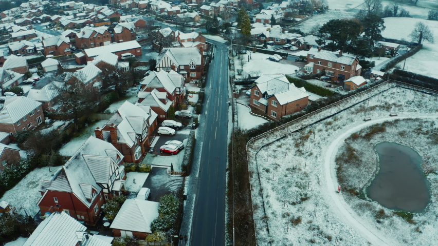 Snowfall and whiter fog over small English rural village in countryside, Cheshire UK. Christmas 2020. Early morning
