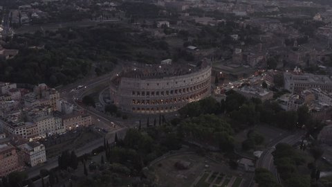 Rome, Italy, 28-08-2020: Flying over Colosseum, Rome, Italy. Aerial view of the Roman Coliseum in the night with drone.