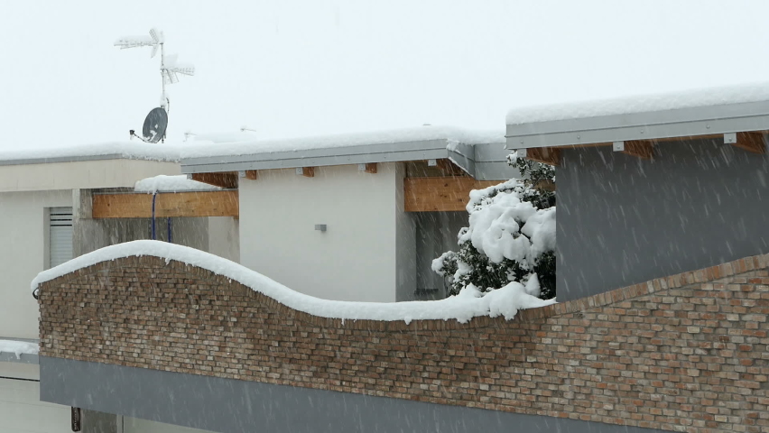 European housing estate in winter. Northern italian city. Residential area in winter. Heavy snowfall in winter.