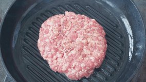 Top view of mince patty on grill pan