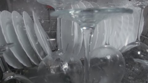 Close up of washing dishes inside a dishwasher.
