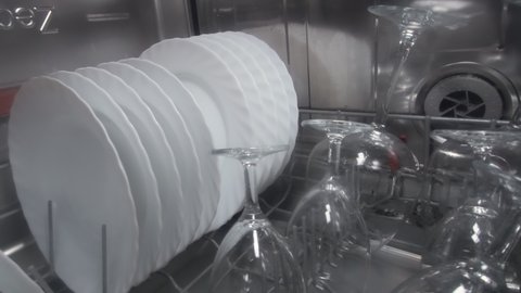 Close up of washing dishes inside a dishwasher.